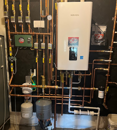 Wall-mounted tankless water heater with copper supply piping installed by JT Plumbing Heating and Air